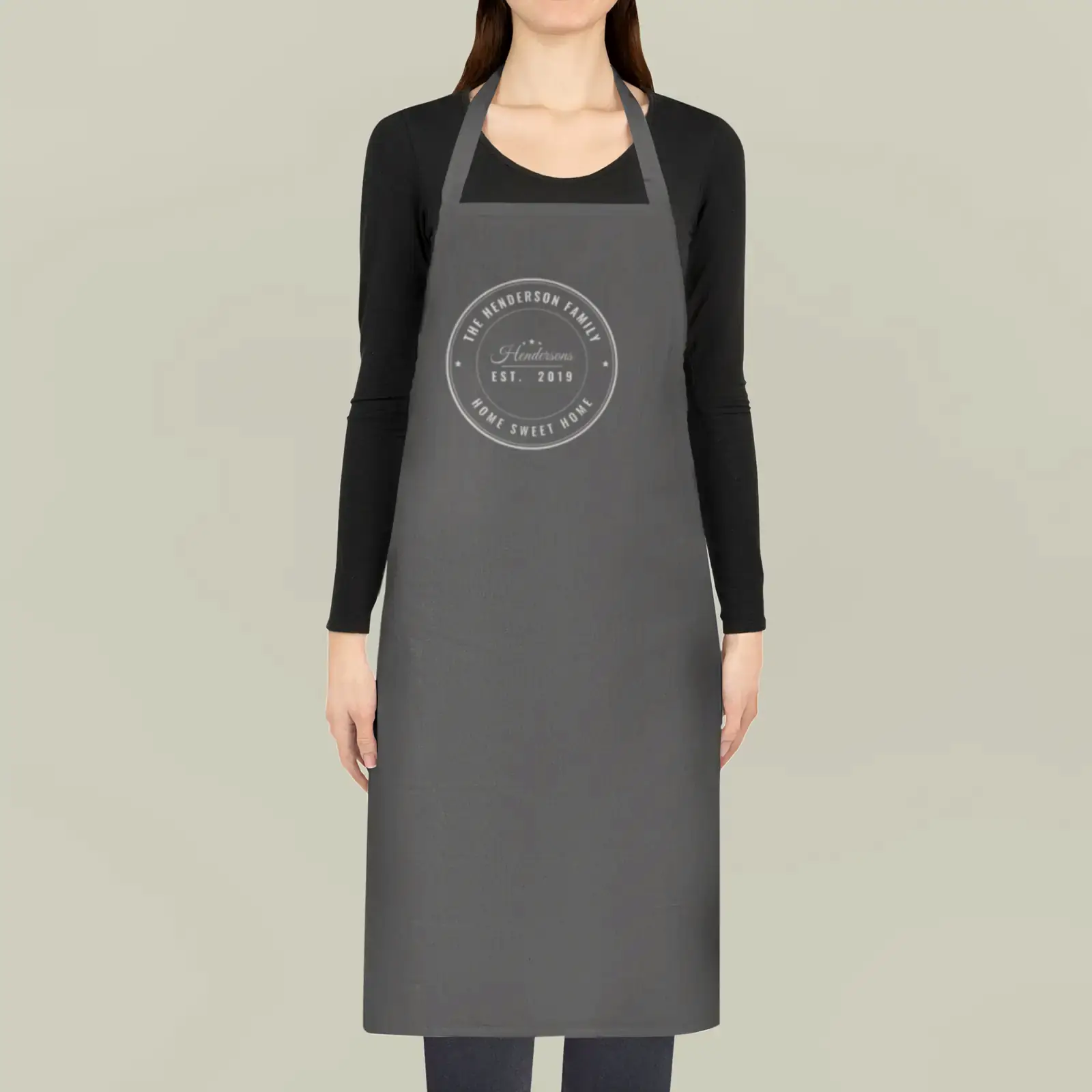 Cotton apron shown with "The Hendersons, Est. 2019", an example design by Vessim