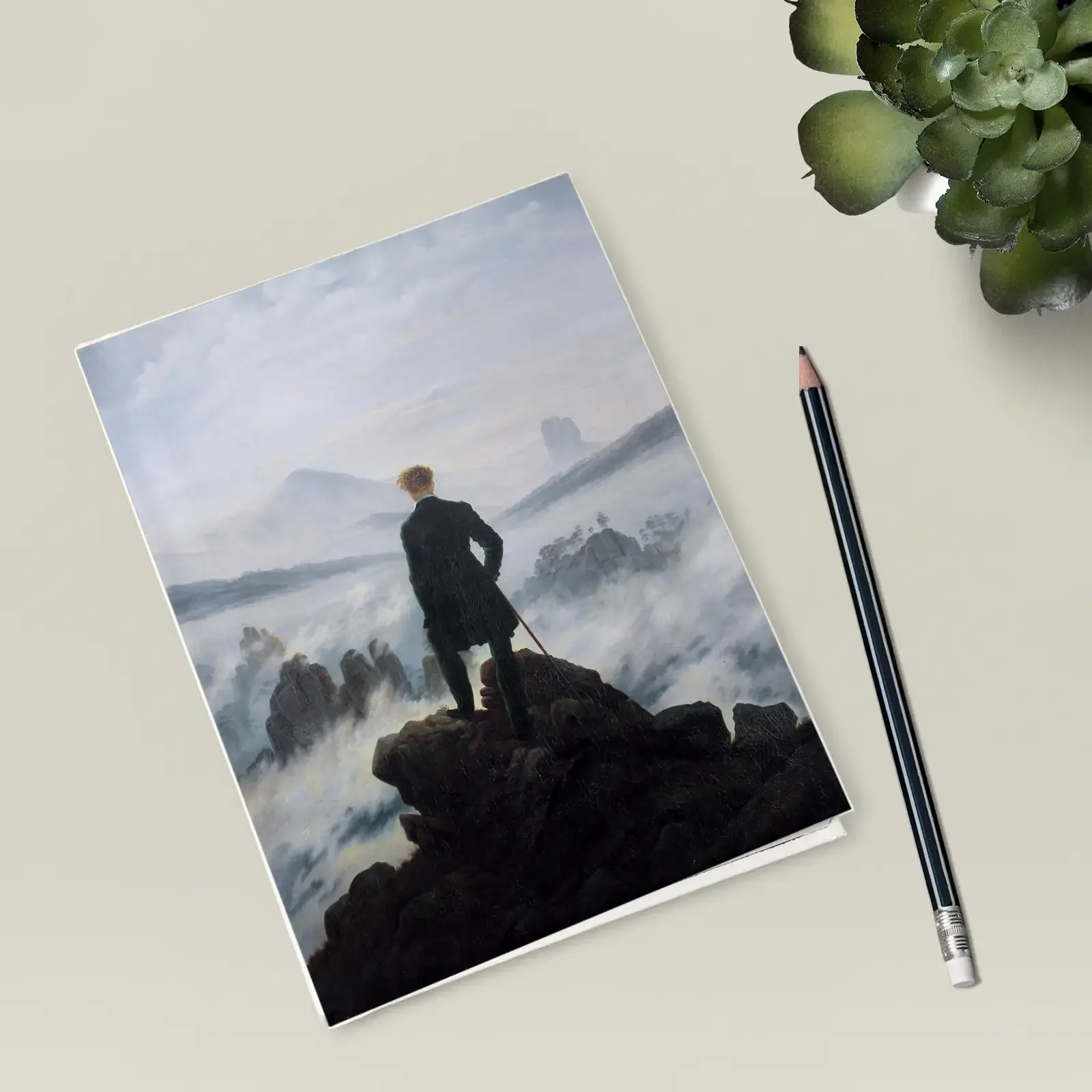 Hardcover journal shown with Wanderer above the Sea of Fog by Caspar David Friedrich, a public-domain example